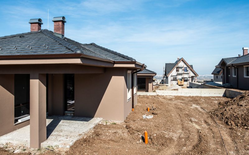 New build houses. Sunny day. Construction site